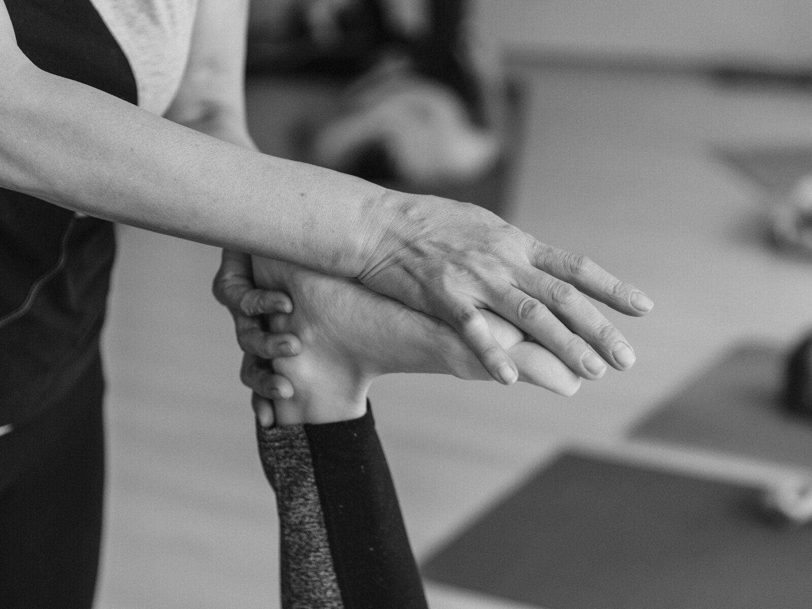 A Pilates instructor guiding a client